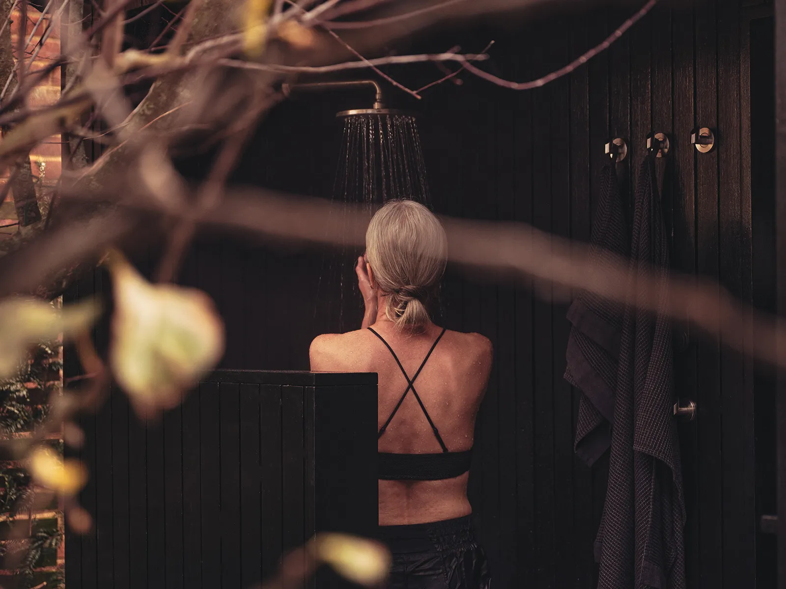 Woman enjoying a Wildhut luxury 2 person outdoor sauna