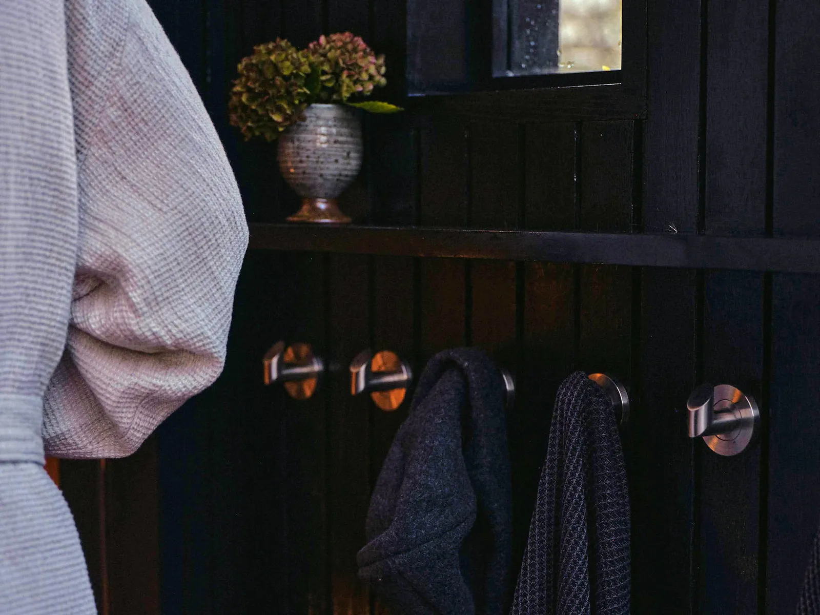 Three Men relaxing outside a Wildhut outdoor Sauna